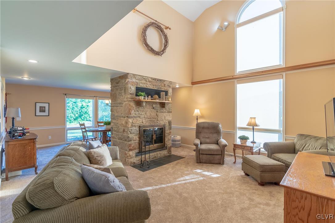 6774 Tollgate Road Zionsville, PA 18092 - Photo 5 of 25 Two sided fireplace between family room and dining