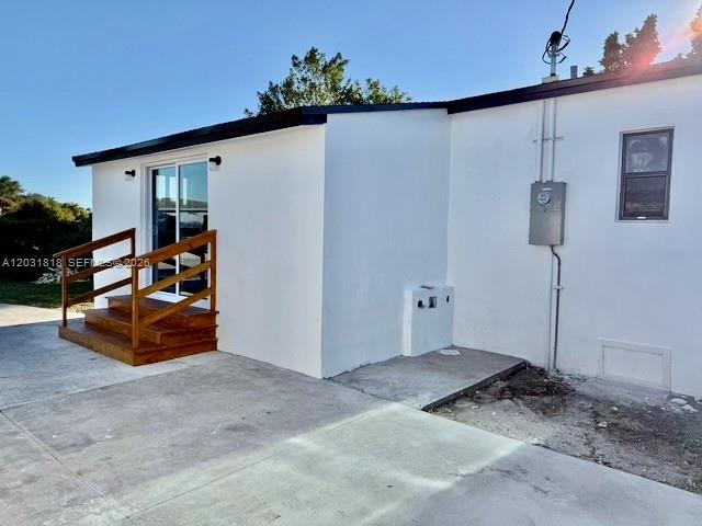 1800 Southwest 75th Avenue Road Miami, FL 33155 - Photo 4 of 17 a bedroom with furniture and a potted plant