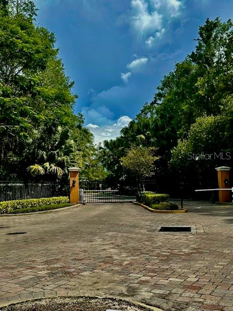 5152 Conroy Road, Unit 35 Orlando, FL 32811 - Photo 3 of 13 a view of a swimming pool with a bench