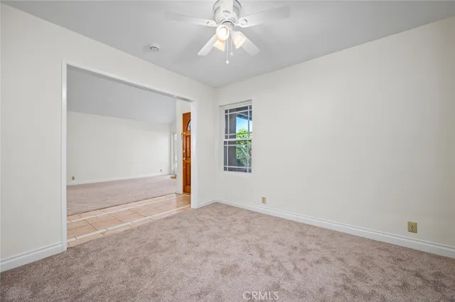 a view of empty room with a fireplace