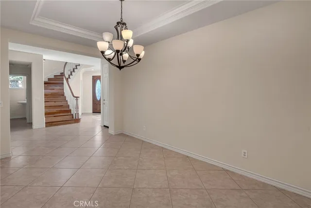 a kitchen with stainless steel appliances granite countertop a sink a stove a refrigerator and island