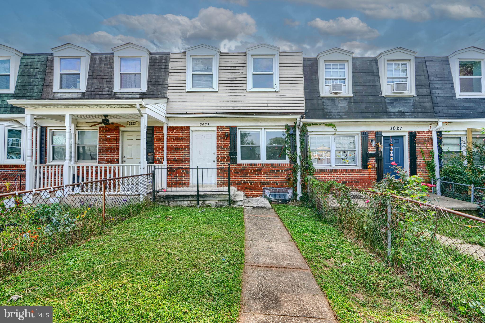 3025 Mallview Road Baltimore, MD 21230 - Photo 1 of 1 a view of a brick house with a yard and large window