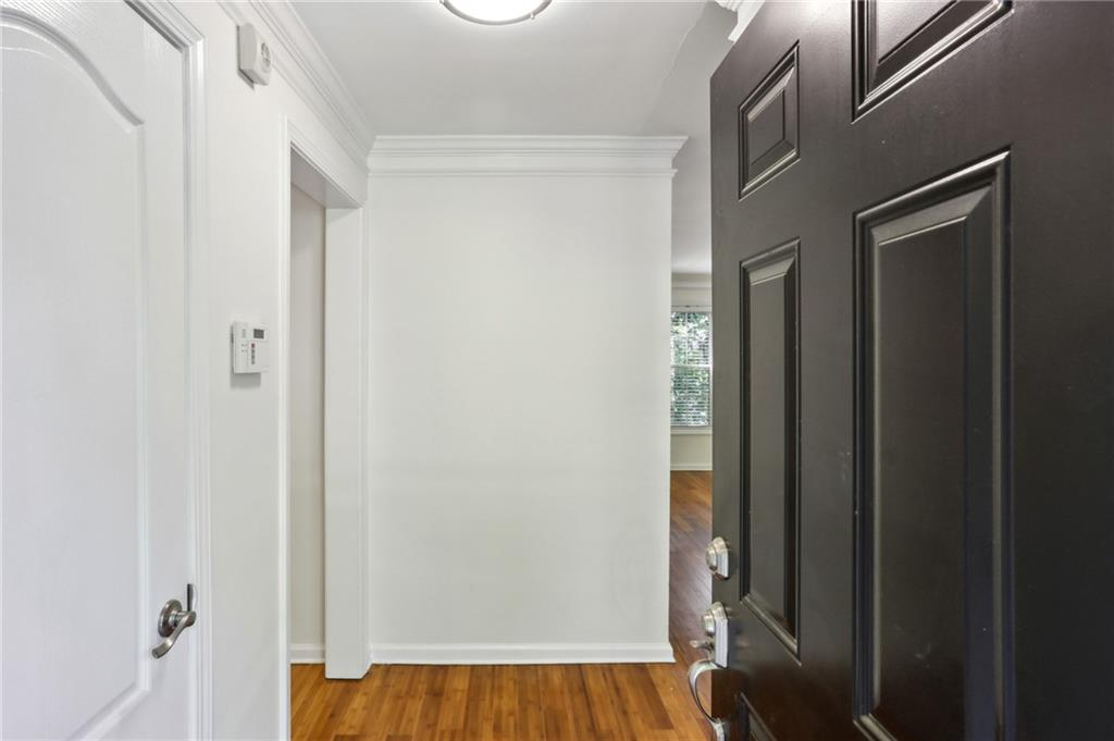 311 Peachtree Hills Avenue Northeast, Unit 13B Atlanta, GA 30305 - Photo 11 of 30 a view of front door with wooden floor