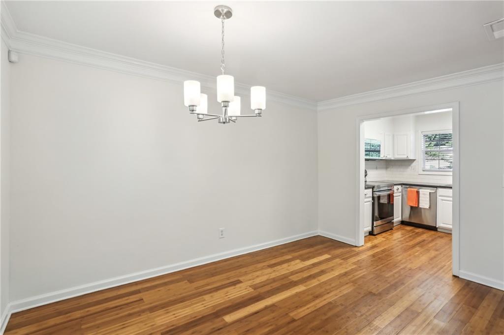 311 Peachtree Hills Avenue Northeast, Unit 13B Atlanta, GA 30305 - Photo 12 of 30 a view of empty room with wooden floor