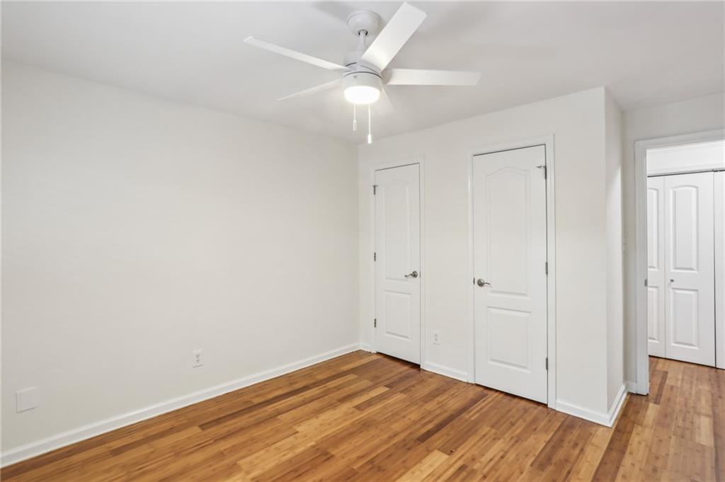 311 Peachtree Hills Avenue Northeast, Unit 13B Atlanta, GA 30305 - Photo 19 of 30 wooden floor in an empty room