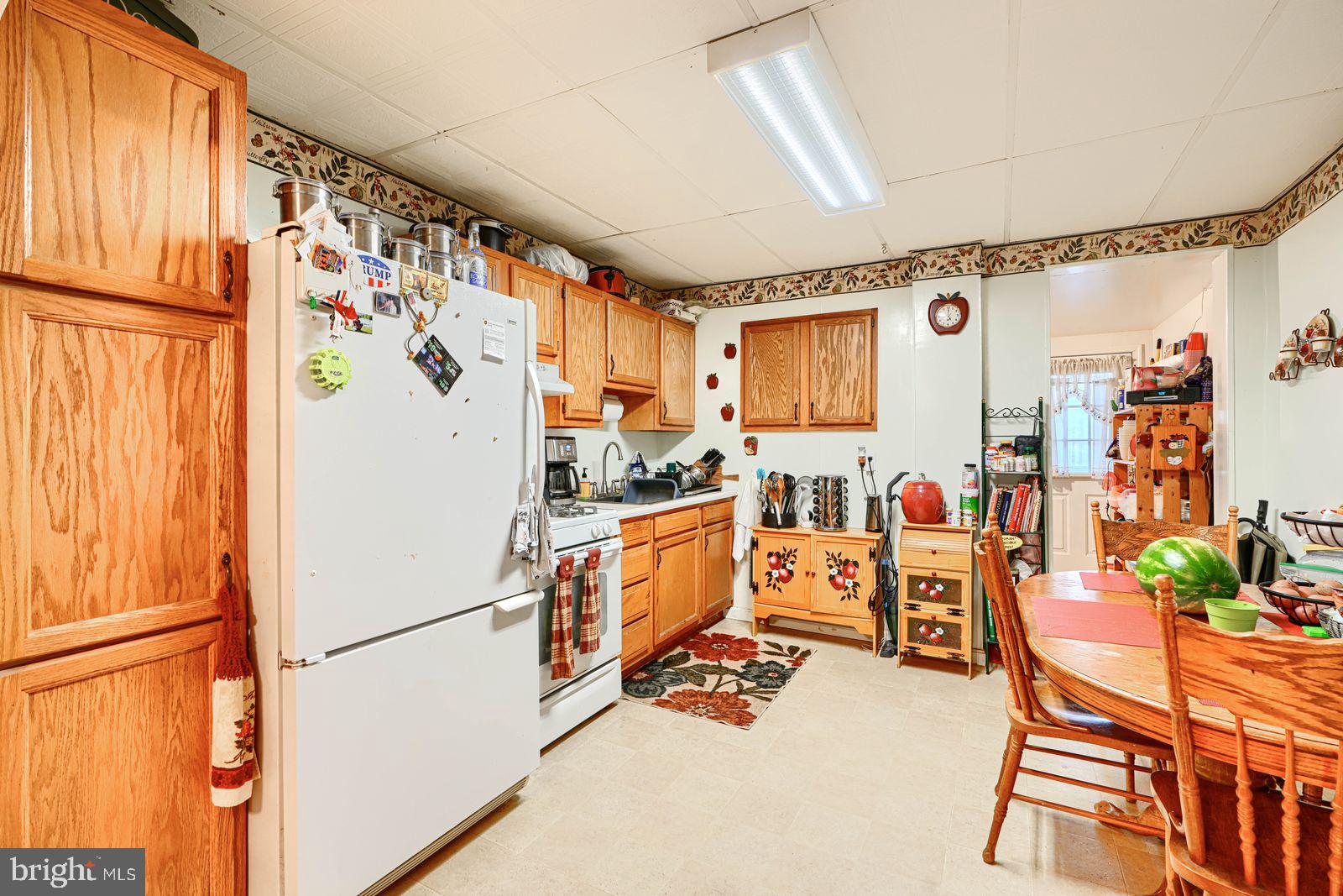 1516 Boyle Street Baltimore, MD 21230 - Photo 12 of 29 a white refrigerator freezer sitting inside of a kitchen