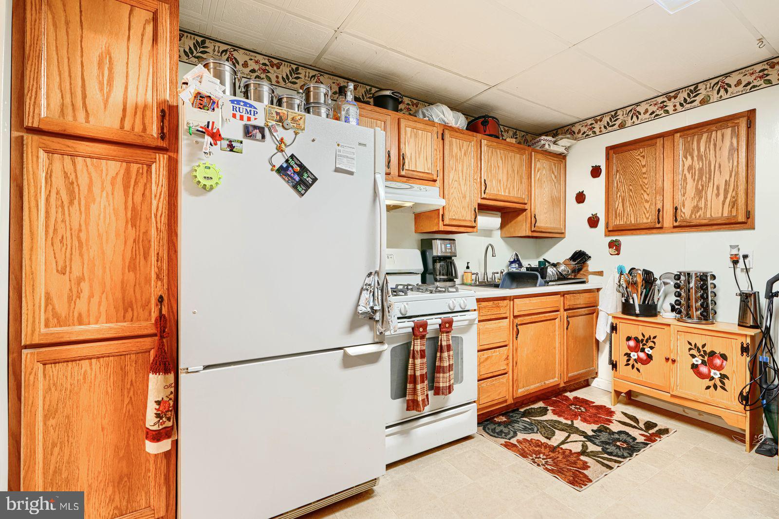 1516 Boyle Street Baltimore, MD 21230 - Photo 13 of 29 a kitchen with stainless steel appliances granite countertop a refrigerator and a sink