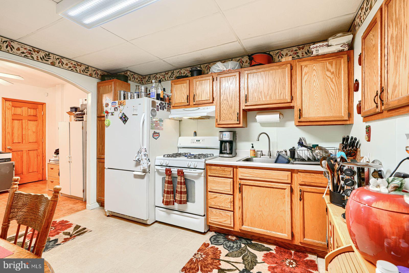 1516 Boyle Street Baltimore, MD 21230 - Photo 14 of 29 a kitchen with stainless steel appliances granite countertop a refrigerator and a stove top oven