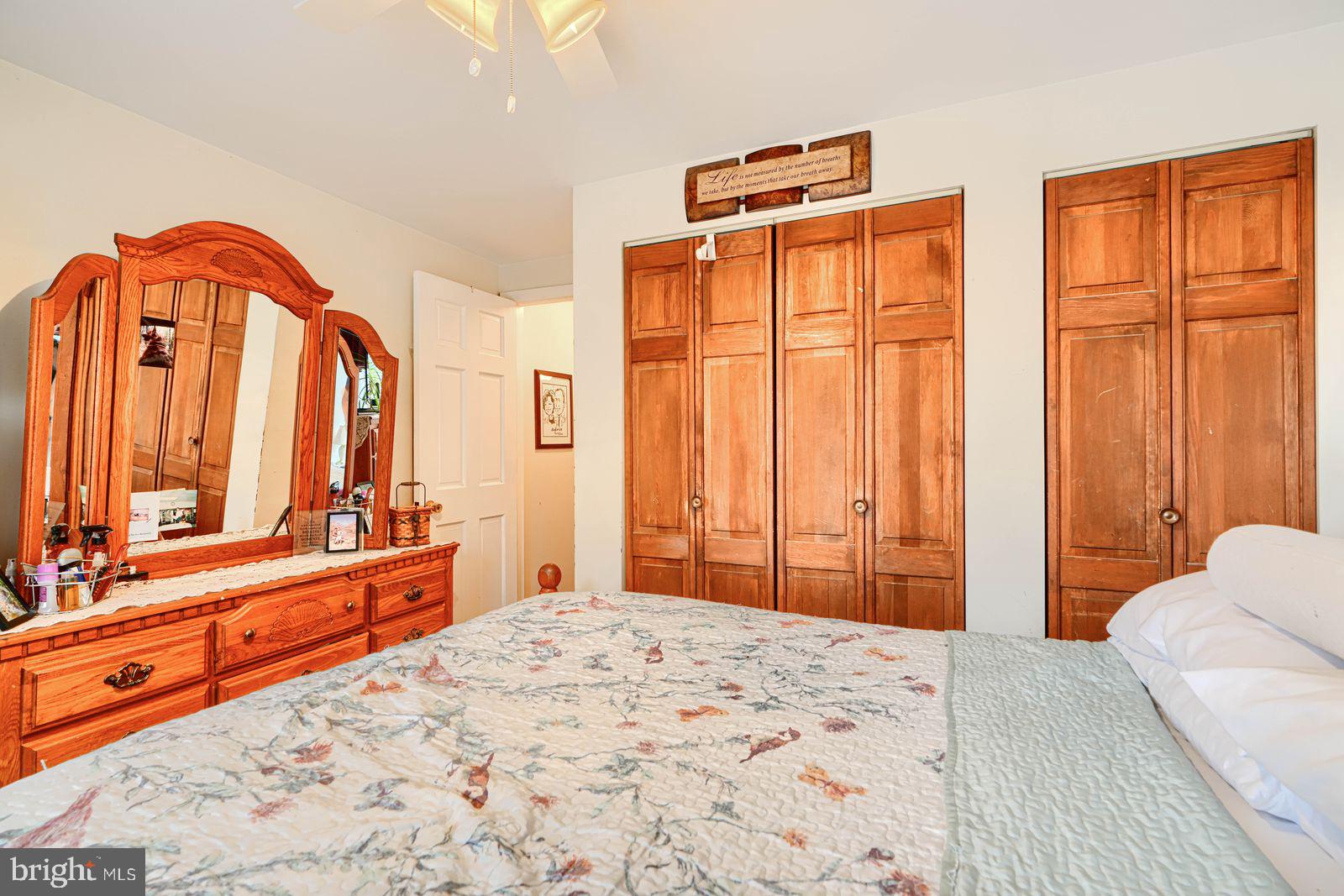 1516 Boyle Street Baltimore, MD 21230 - Photo 19 of 29 a bedroom with a bed and a dresser