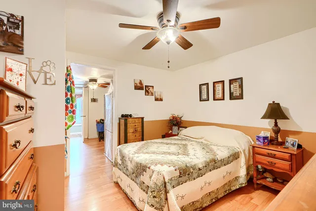 a bed room with a bed and a chandelier