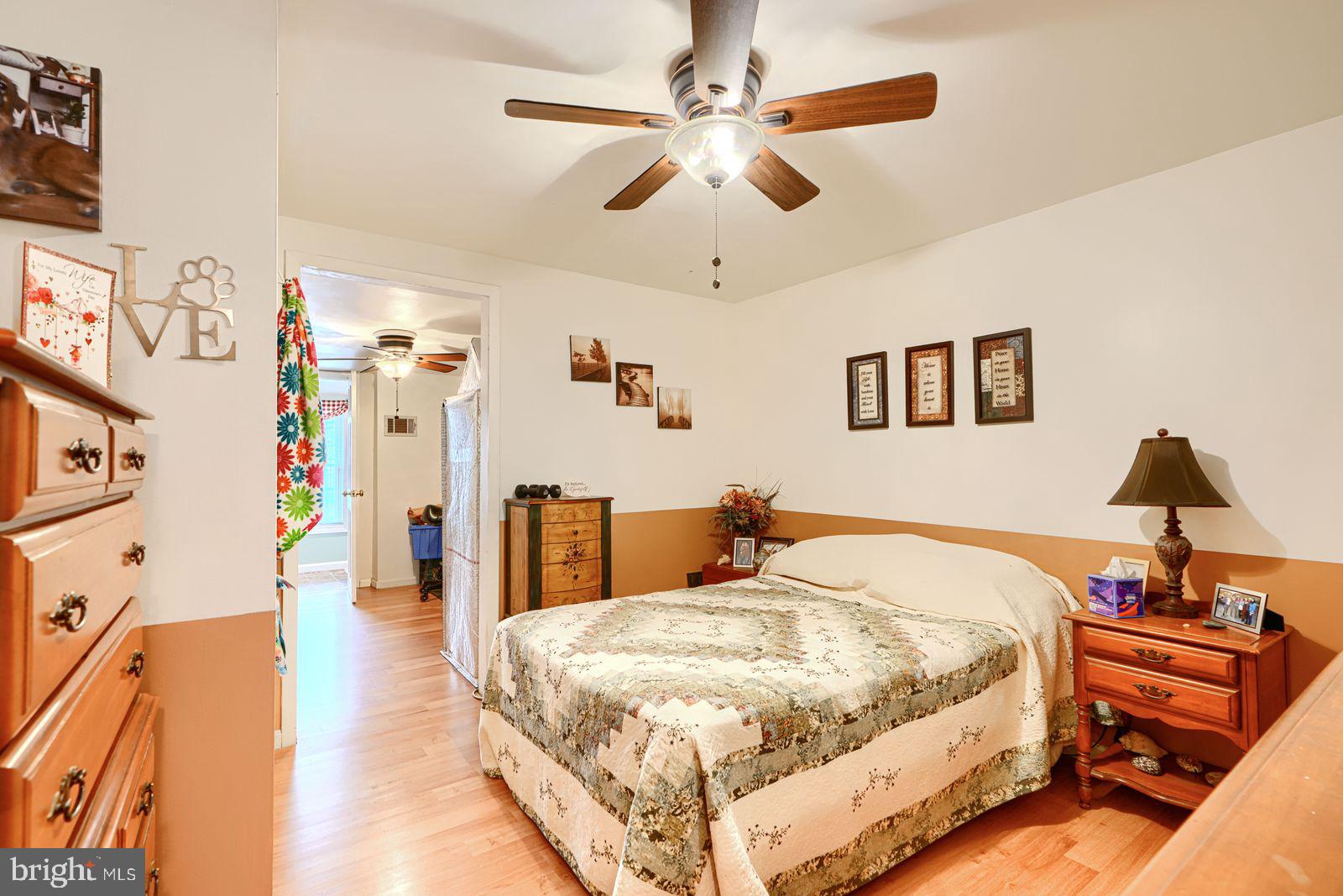 1516 Boyle Street Baltimore, MD 21230 - Photo 20 of 29 a bed room with a bed and a chandelier