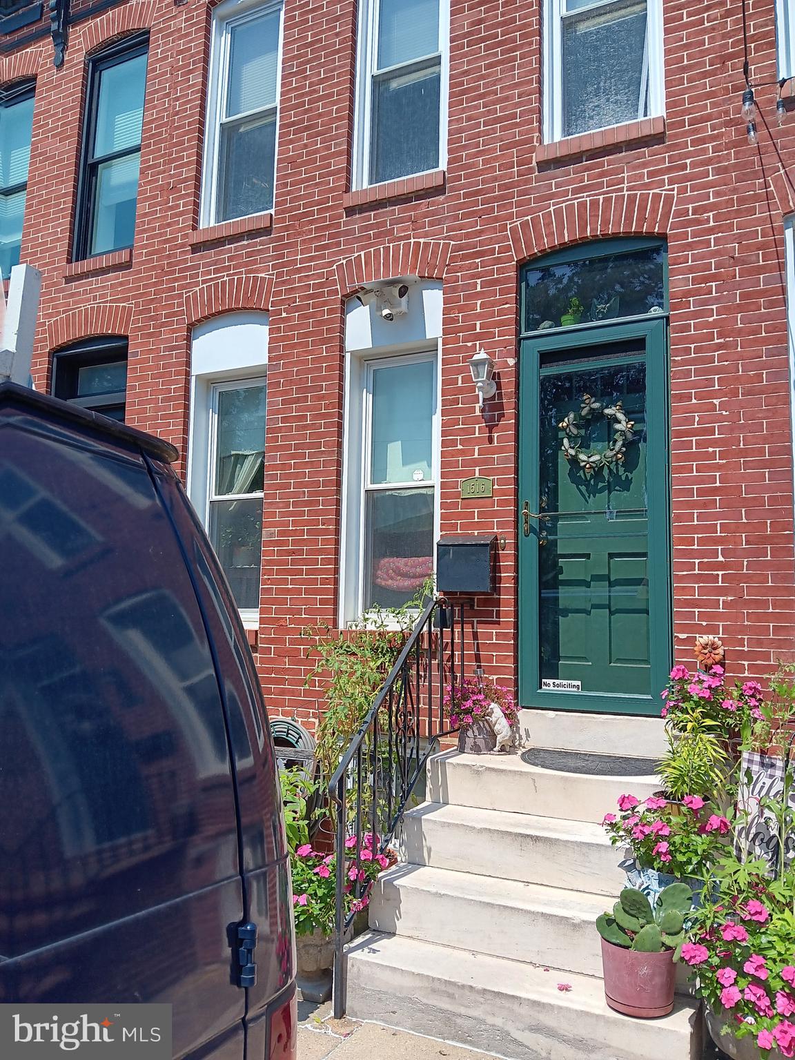 1516 Boyle Street Baltimore, MD 21230 - Photo 2 of 29 a front view of a house with a porch