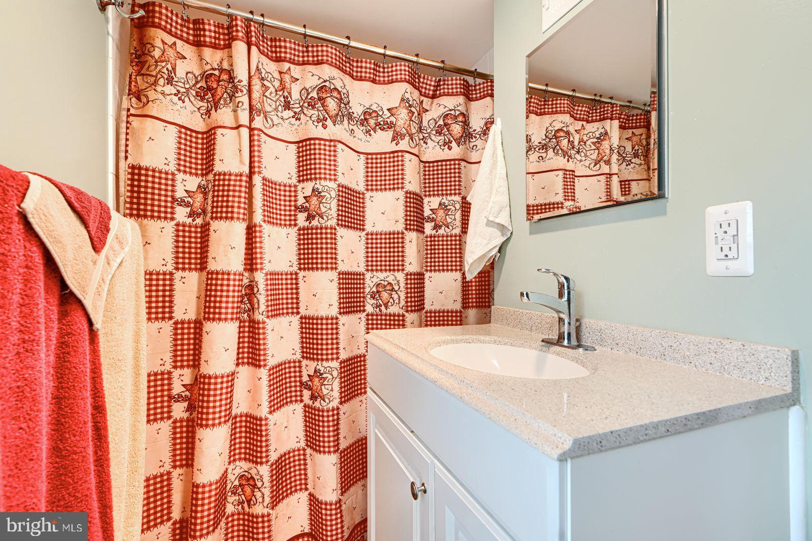 1516 Boyle Street Baltimore, MD 21230 - Photo 24 of 29 a bathroom with a sink and a mirror