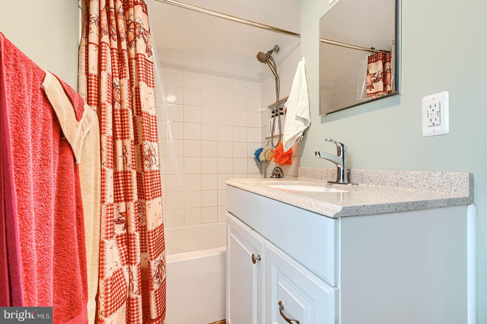 1516 Boyle Street Baltimore, MD 21230 - Photo 25 of 29 a bathroom with a sink and a mirror