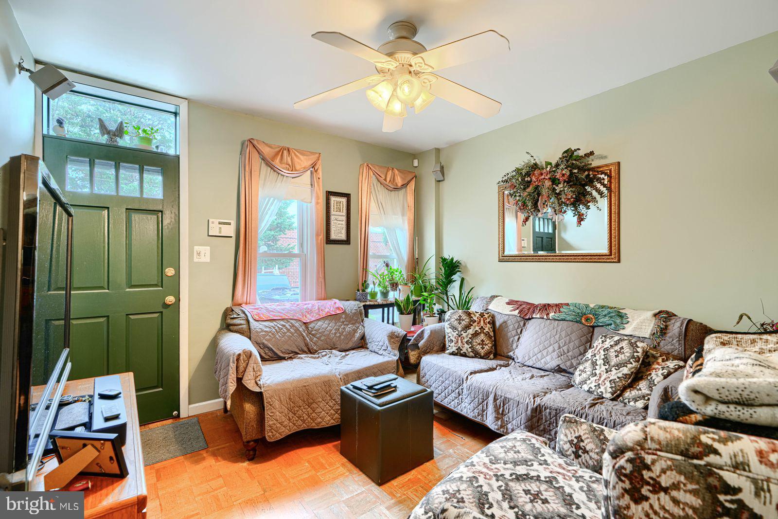 1516 Boyle Street Baltimore, MD 21230 - Photo 7 of 29 a living room with furniture and a large window