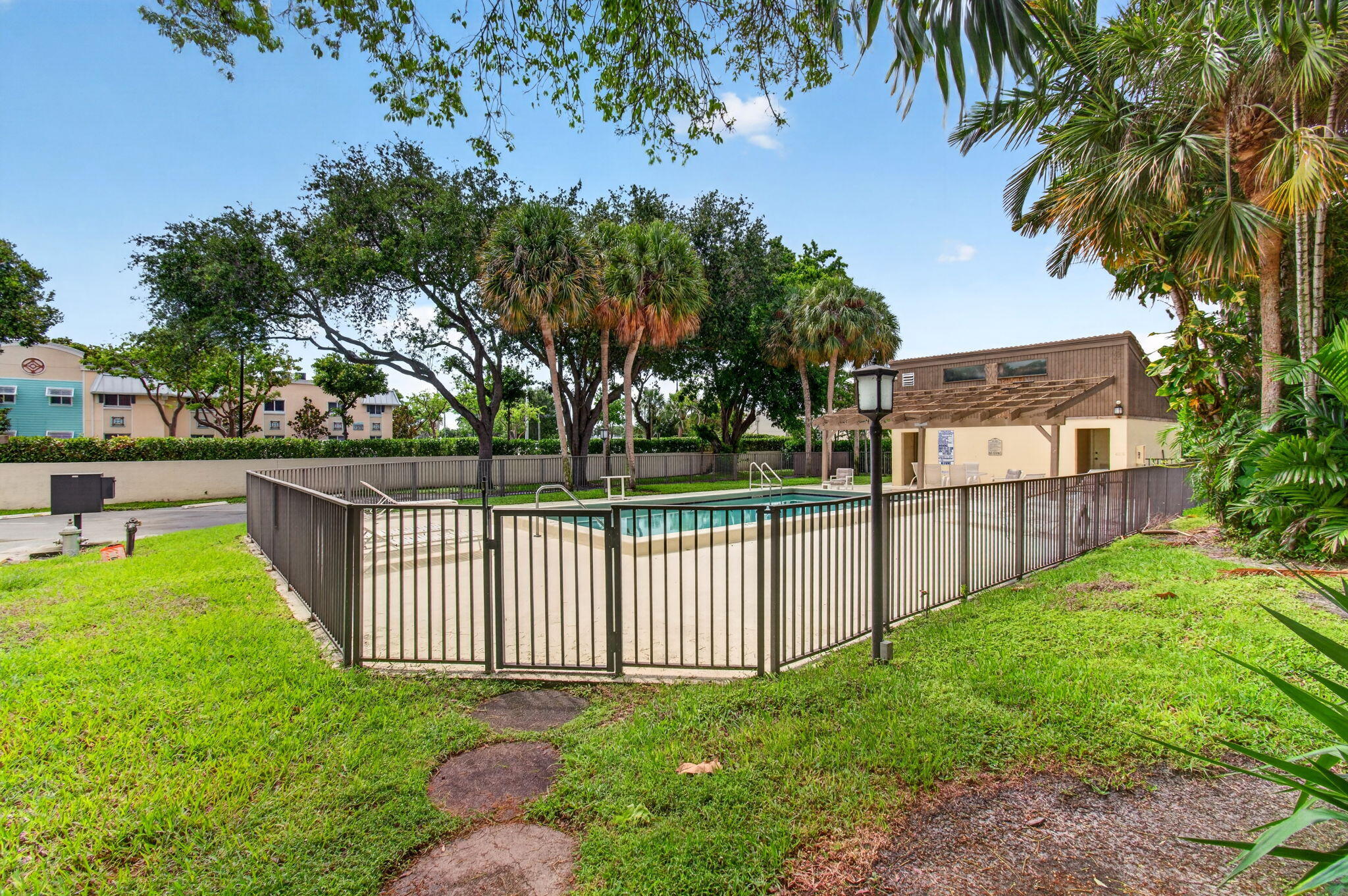 1330 Northwest 13th Street, Unit 12 Boca Raton, FL 33486 - Photo 50 of 52 a view of a backyard with a garden