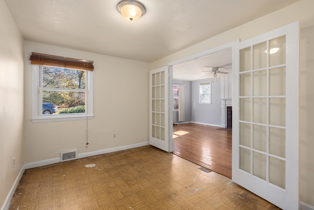 186 Bolton Street Springfield, MA 01119 - Photo 11 of 34 an empty room with wooden floor and windows