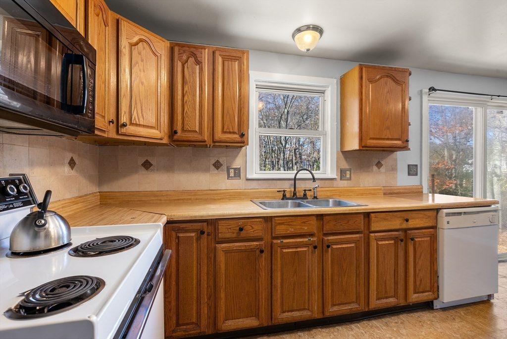 186 Bolton Street Springfield, MA 01119 - Photo 13 of 34 a kitchen with a sink stove top oven and cabinets