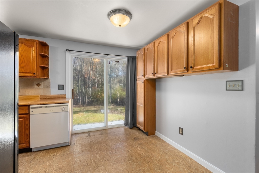 186 Bolton Street Springfield, MA 01119 - Photo 15 of 34 a view of an empty room with window and a kitchen