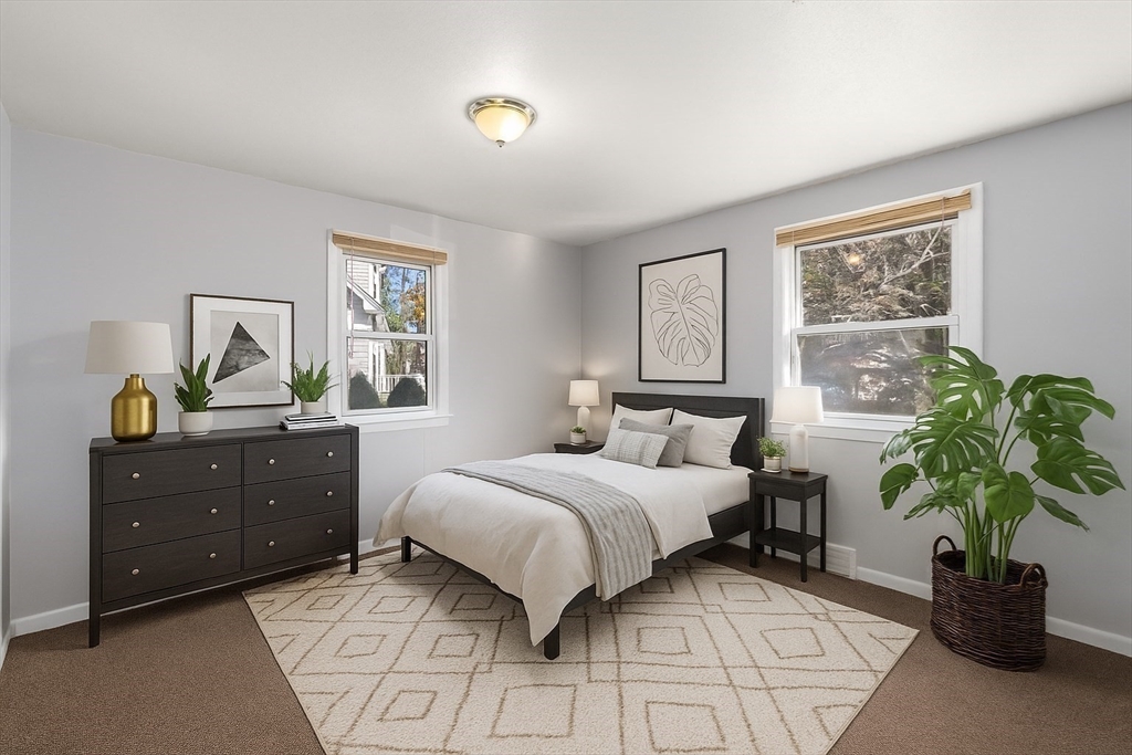 186 Bolton Street Springfield, MA 01119 - Photo 19 of 34 a bedroom with a bed and a potted plant