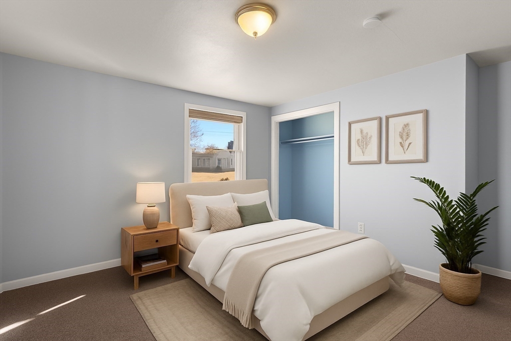 186 Bolton Street Springfield, MA 01119 - Photo 22 of 34 a bedroom with a bed and a potted plant