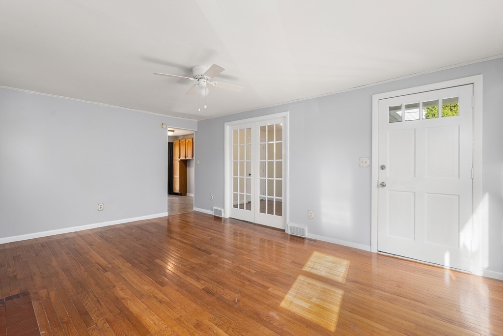 186 Bolton Street Springfield, MA 01119 - Photo 8 of 34 wooden floor in an empty room with a window