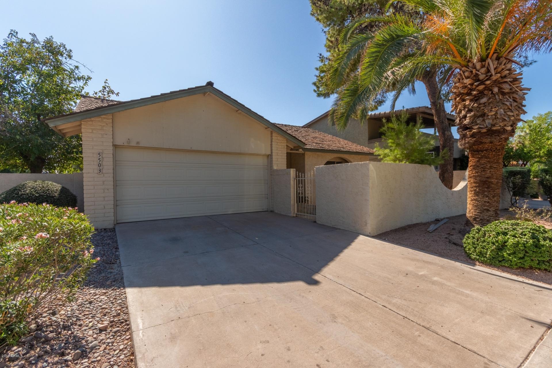 5503 South Rocky Point Road Tempe, AZ 85283 - Photo 21 of 22 a view of a house with a yard and tree