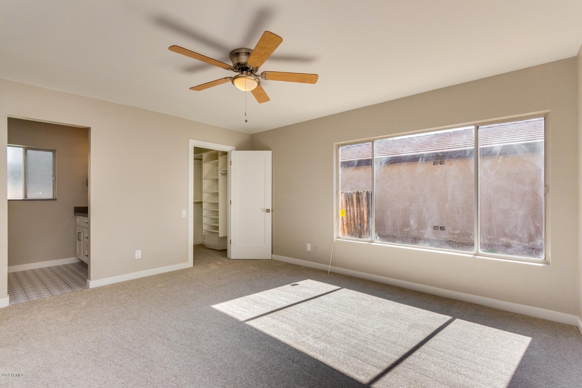 5503 South Rocky Point Road Tempe, AZ 85283 - Photo 7 of 22 a view of an empty room with a window