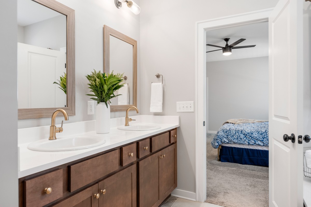 883 Plowson Road Mount Juliet, TN 37122 - Photo 29 of 47 a en suite bathroom with a double vanity sink and mirror