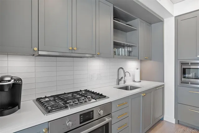 a hall with cabinets and wooden floor