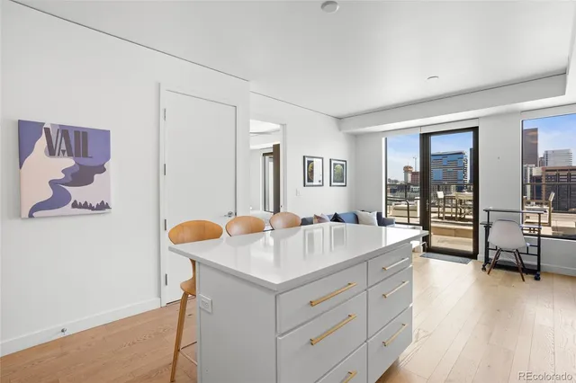 a bedroom with a bed next to a window