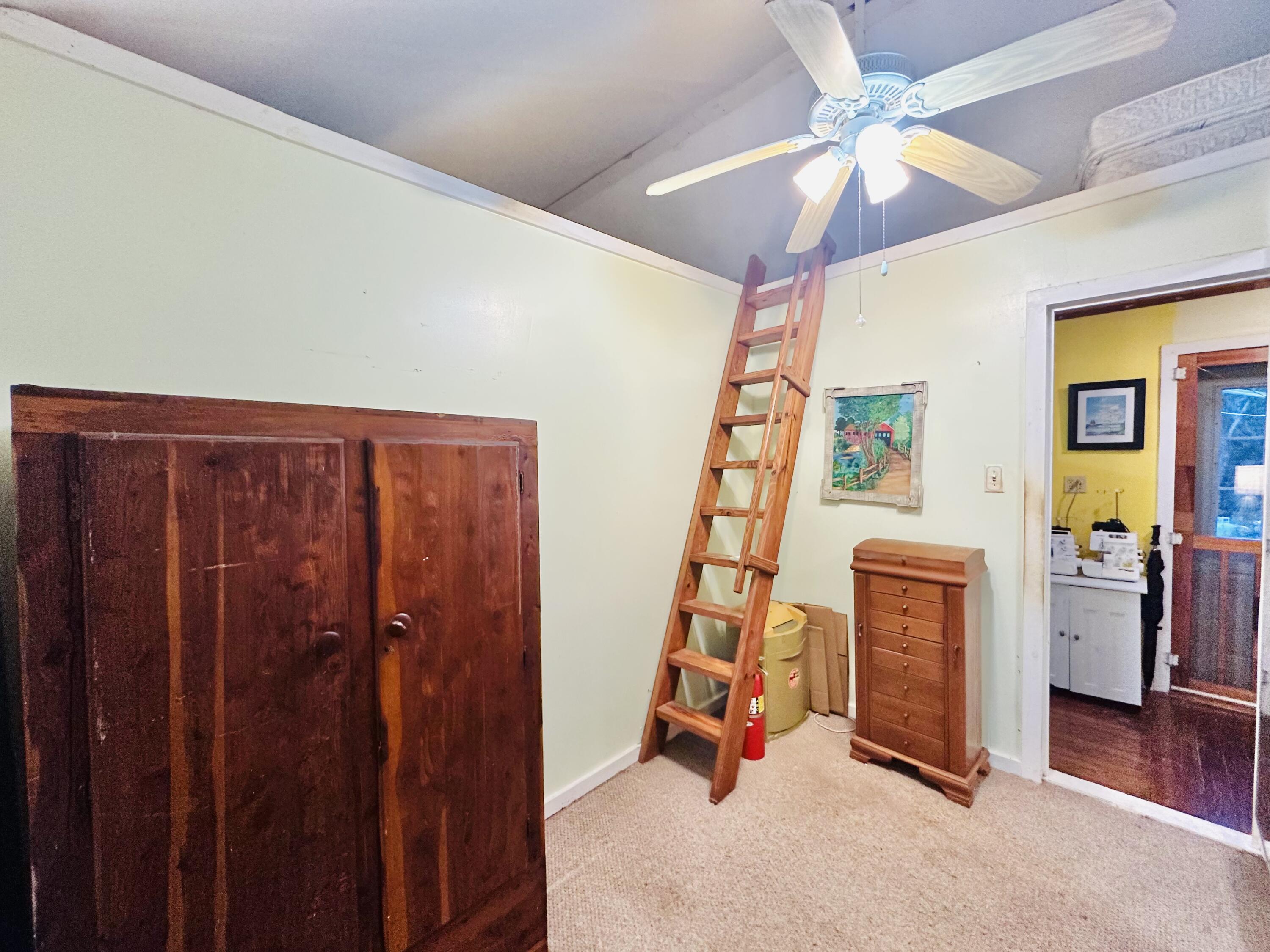 21857 Disturbed Pine Road Cudjoe, FL 33042 - Photo 16 of 31 a view of an empty room with a window