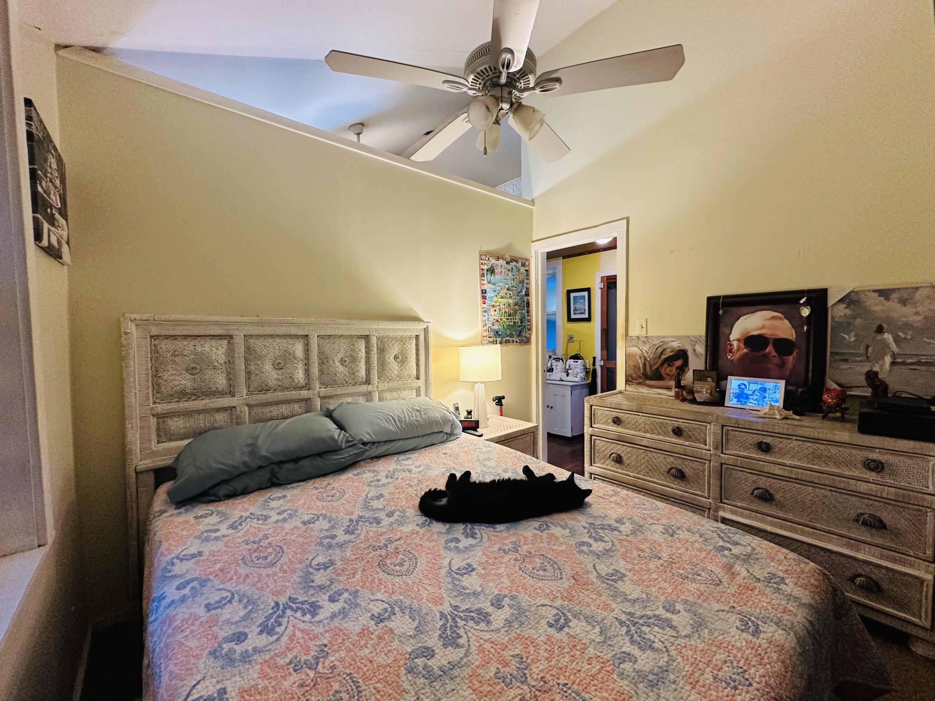 21857 Disturbed Pine Road Cudjoe, FL 33042 - Photo 20 of 30 a bedroom with a bed and a dresser