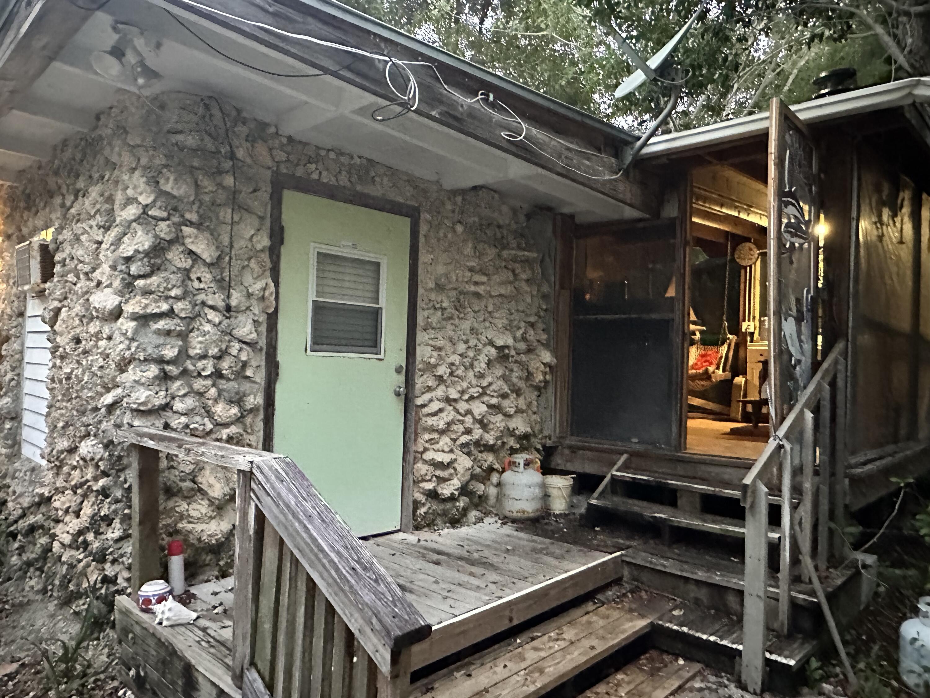 21857 Disturbed Pine Road Cudjoe, FL 33042 - Photo 3 of 31 a view of an outdoor space with seating area