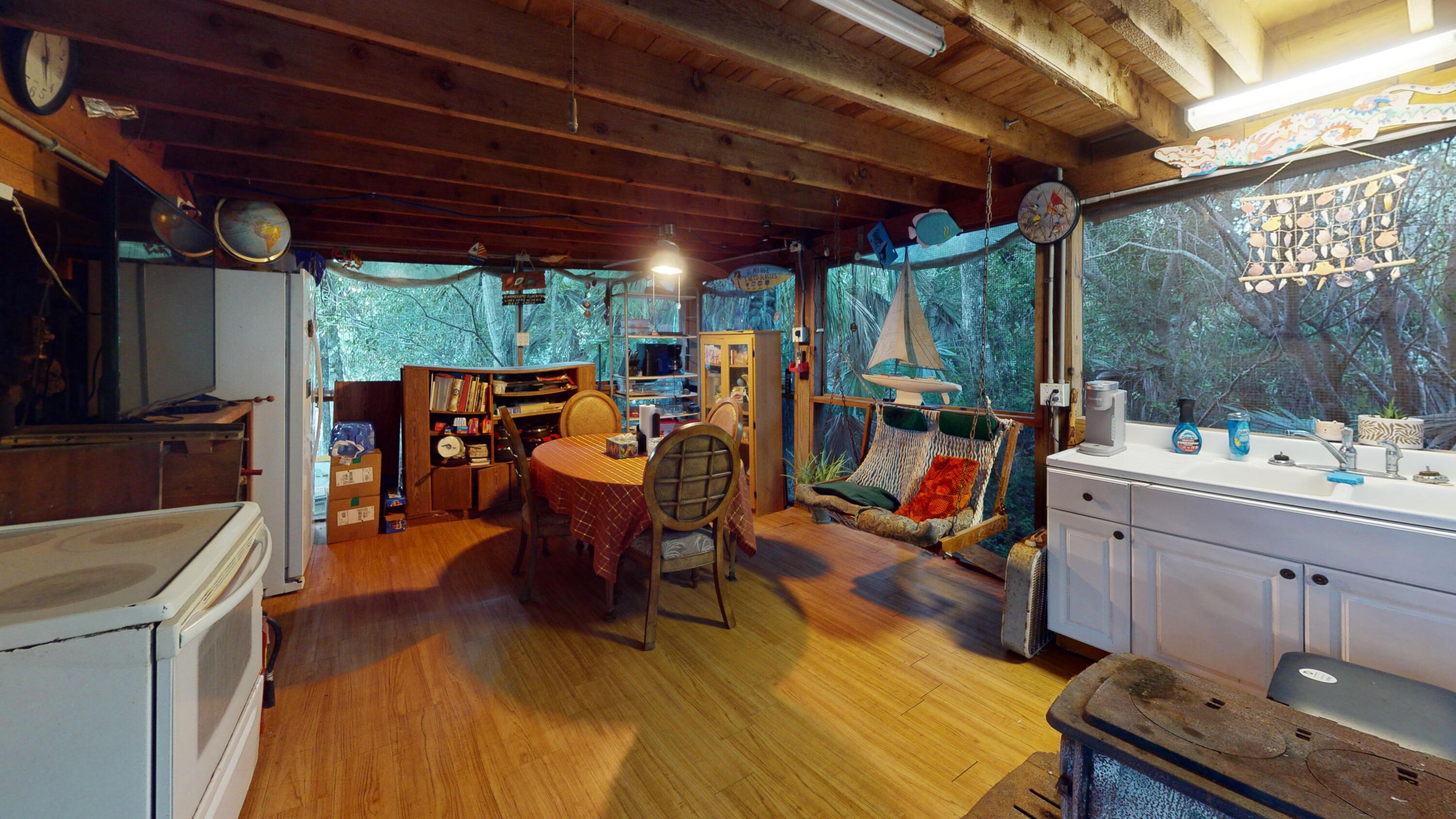 21857 Disturbed Pine Road Cudjoe, FL 33042 - Photo 6 of 31 a view of a patio with dining table and chairs