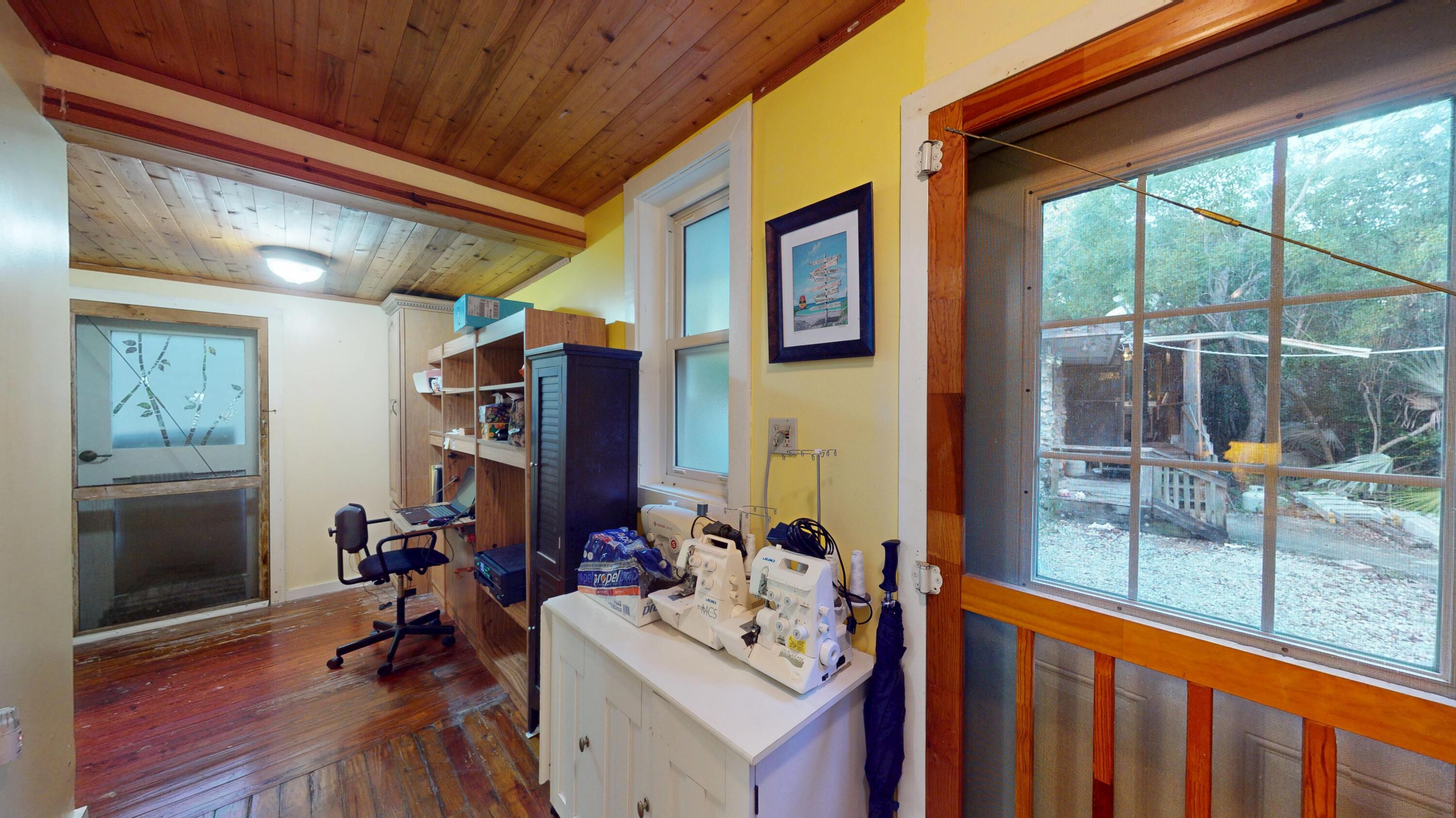 21857 Disturbed Pine Road Cudjoe, FL 33042 - Photo 9 of 31 a room with furniture and a window