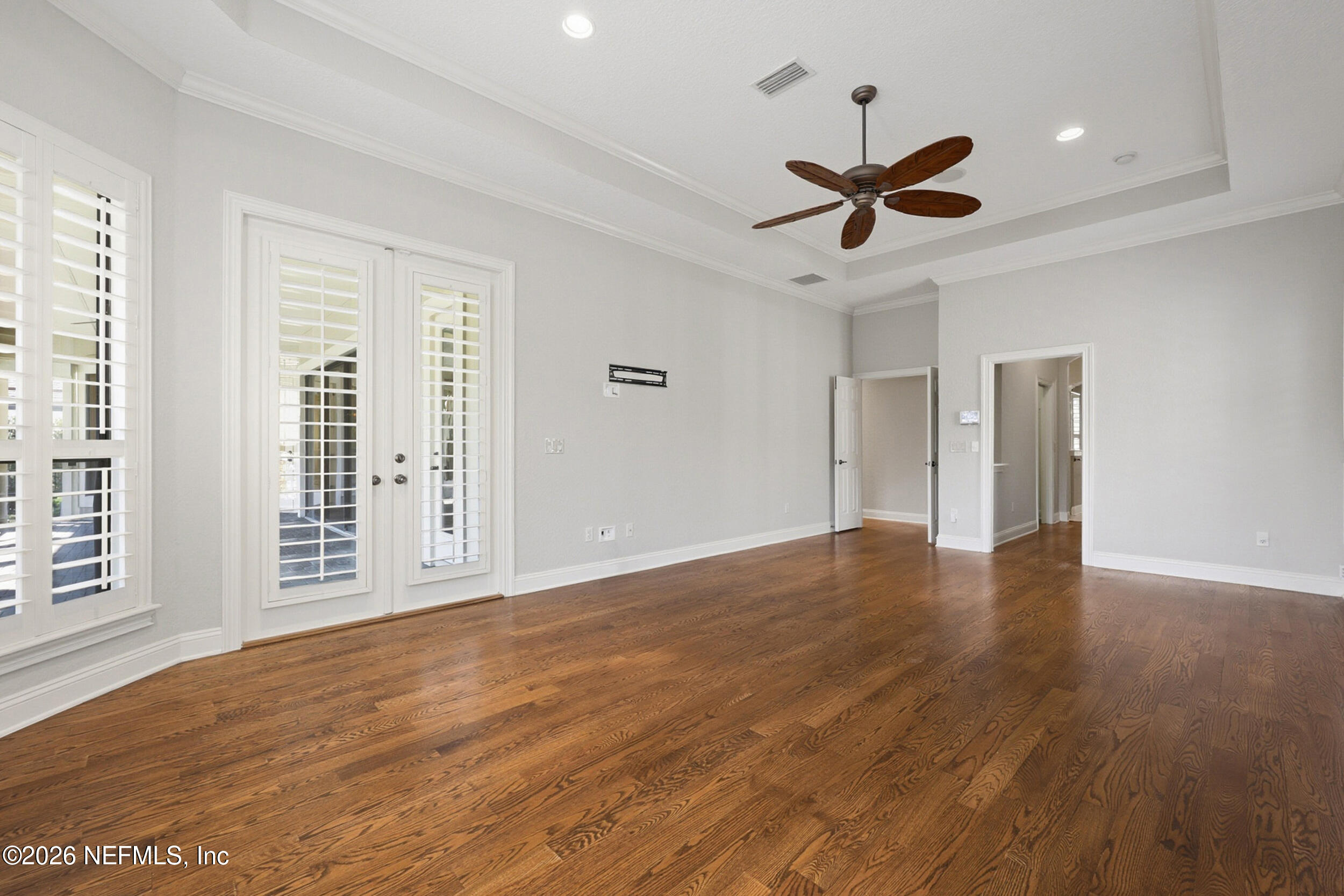 661 Treehouse Circle St. Augustine, FL 32095 - Photo 23 of 89 Primary Bedroom Doors To Lanai