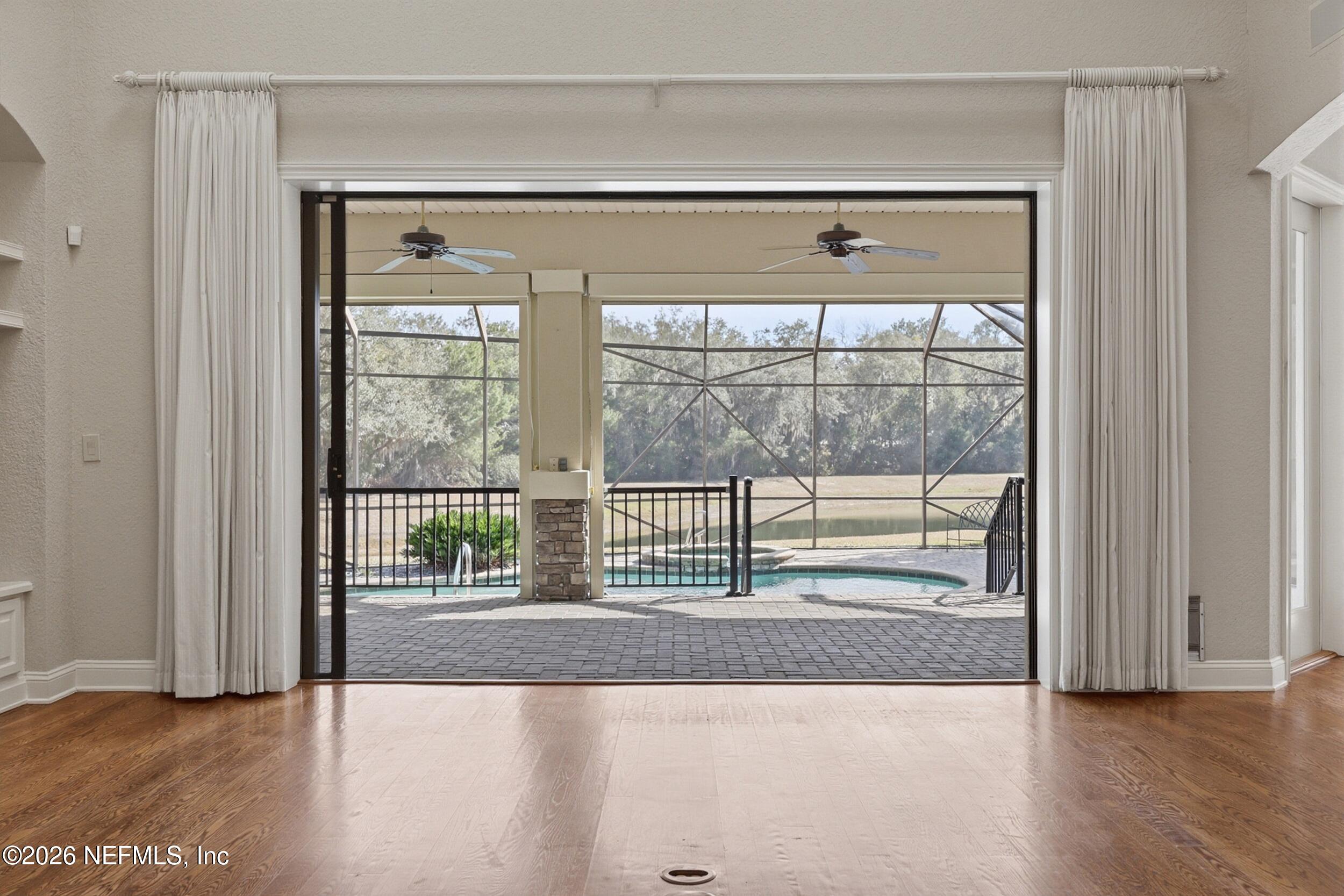 661 Treehouse Circle St. Augustine, FL 32095 - Photo 7 of 89 Sliders to Covered Lanai