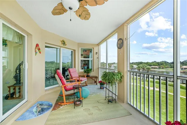 a living room with furniture and view of kitchen