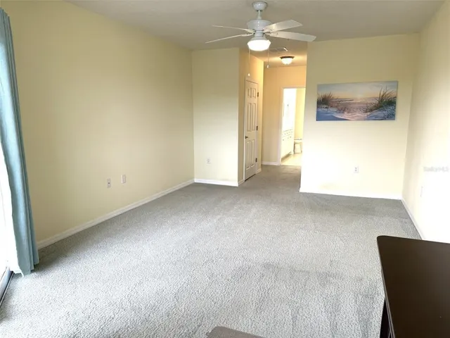 a view of walk in closet with clothes