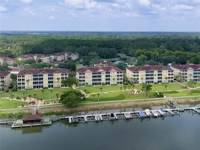 a bedroom with two beds and a chandelier
