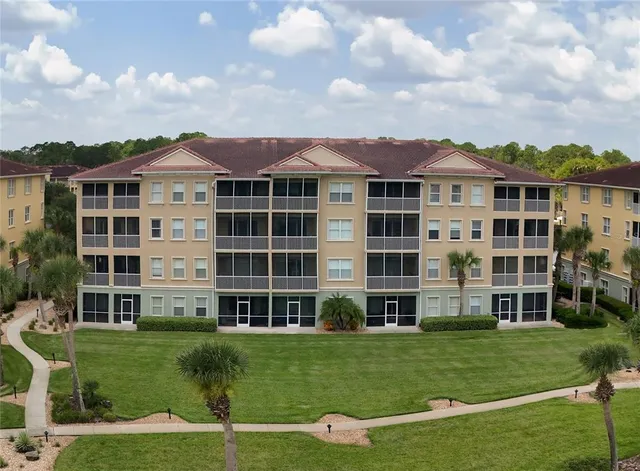 aerial view of a house with garden space and street view