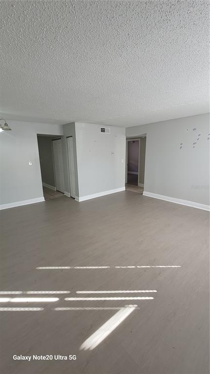 12403 Hibiscus Oak Place, Unit 101 Tampa, FL 33612 - Photo 3 of 9 a view of a livingroom with an empty space