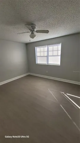 an empty room with a empty space and windows