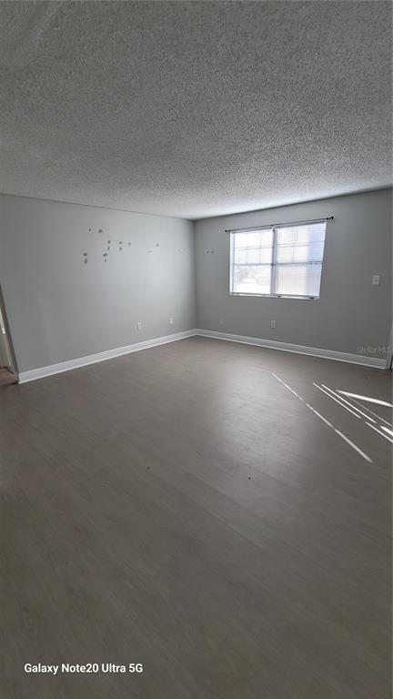 12403 Hibiscus Oak Place, Unit 101 Tampa, FL 33612 - Photo 7 of 9 an empty room with windows and closet