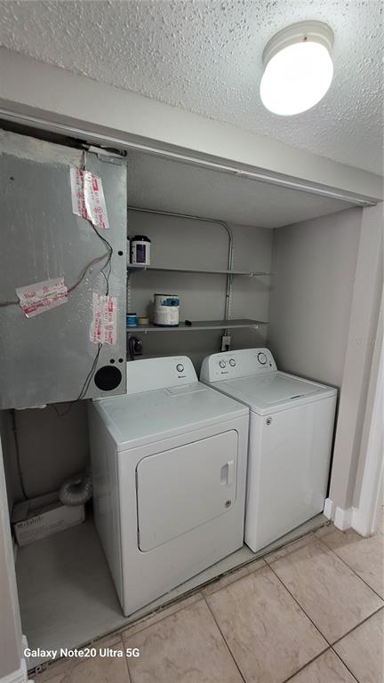 12403 Hibiscus Oak Place, Unit 101 Tampa, FL 33612 - Photo 9 of 9 a utility room with dryer and washer