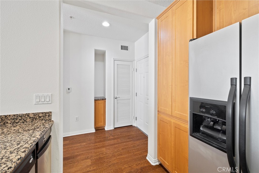 12688 Chapman Avenue, Unit 3201 Garden Grove, CA 92840 - Photo 4 of 17 a view of a kitchen with refrigerator and an oven