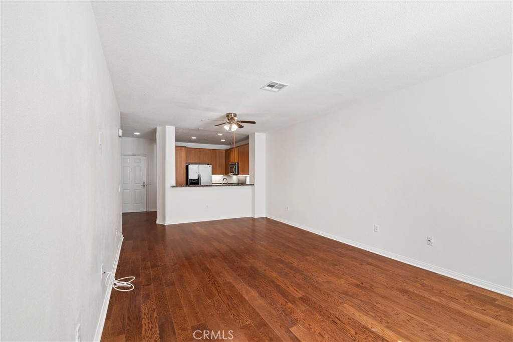12688 Chapman Avenue, Unit 3201 Garden Grove, CA 92840 - Photo 7 of 17 a view of a kitchen with wooden floor