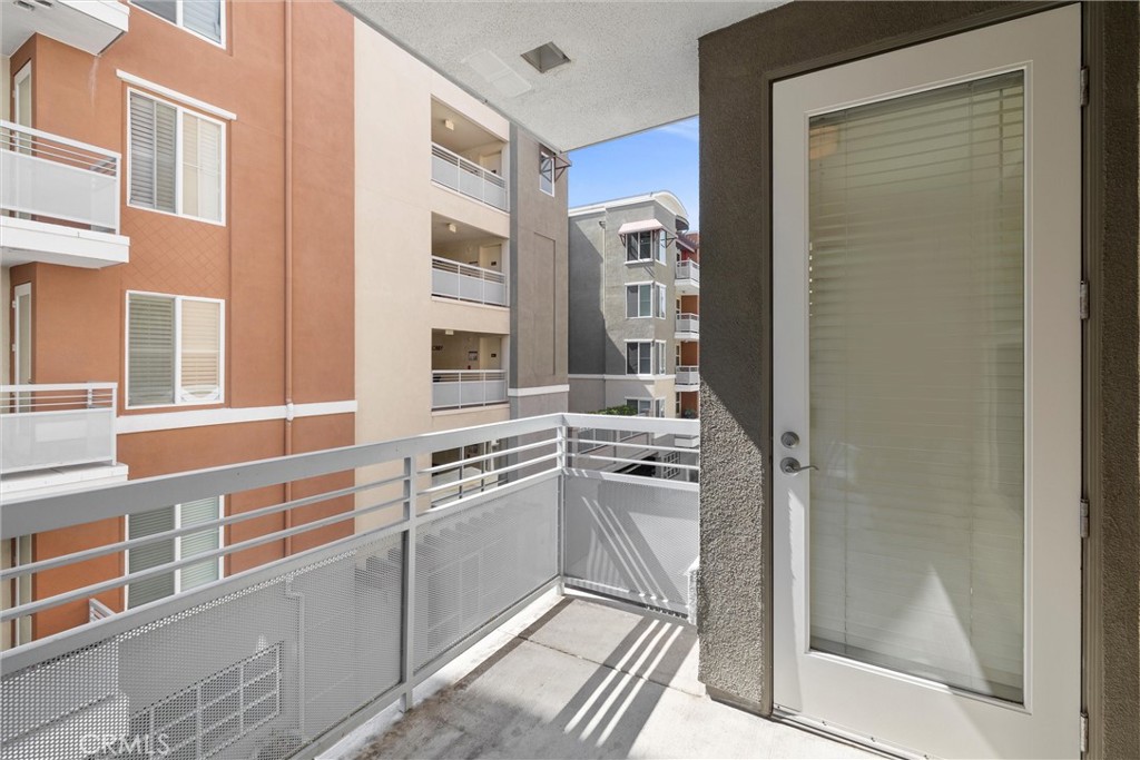 12688 Chapman Avenue, Unit 3201 Garden Grove, CA 92840 - Photo 8 of 17 a kitchen with stainless steel appliances granite countertop a refrigerator and a sink