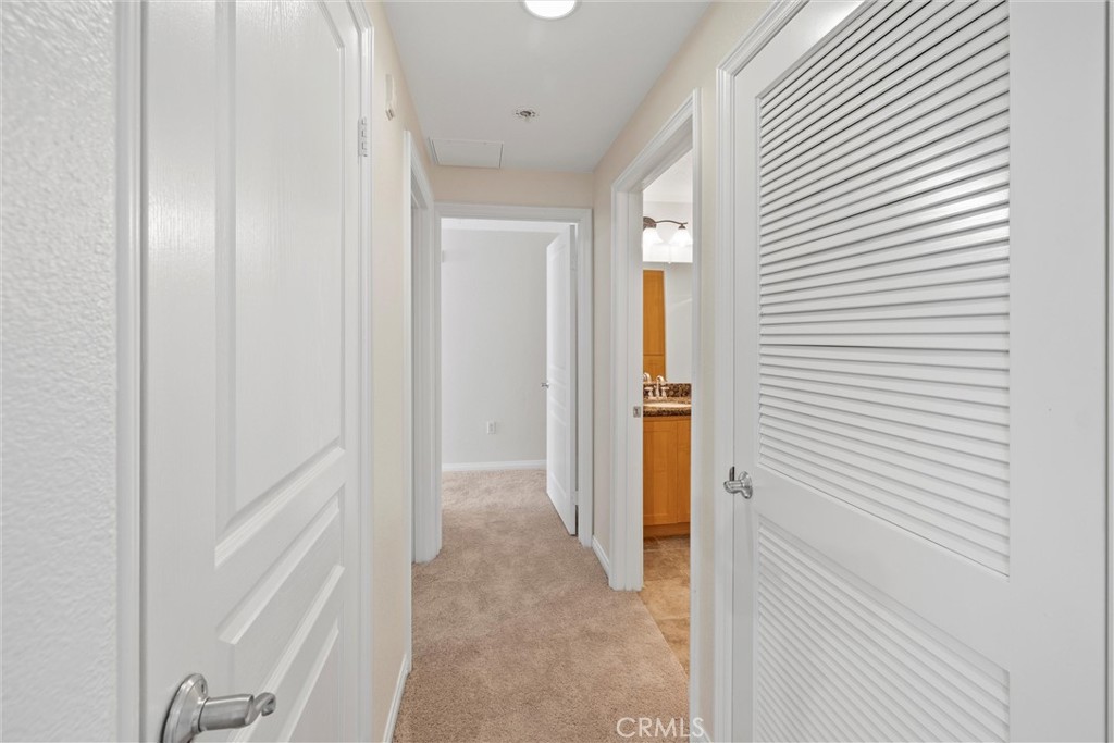 12688 Chapman Avenue, Unit 3201 Garden Grove, CA 92840 - Photo 9 of 17 a view of a hallway with wooden floor and entryway